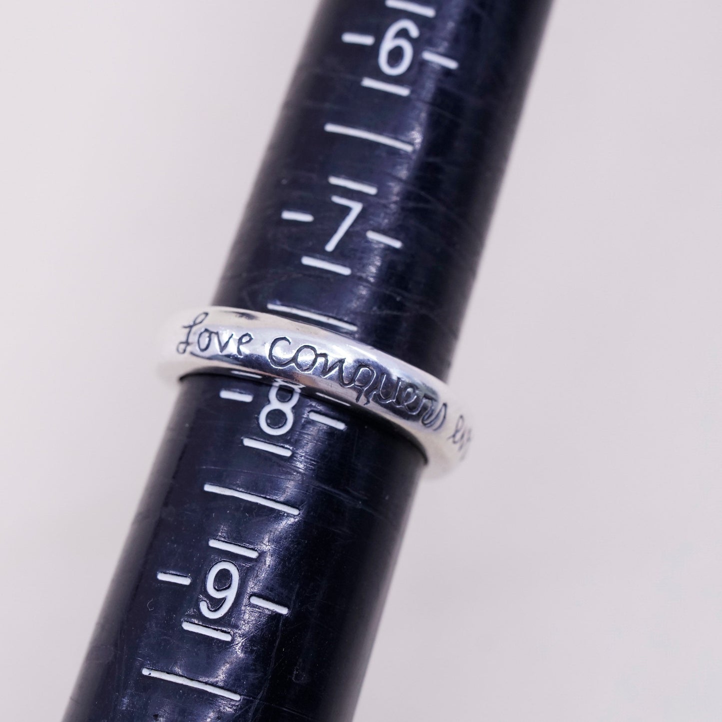 sz 7.75, vtg sterling silver handmade ring, 925 quote band “love conquers