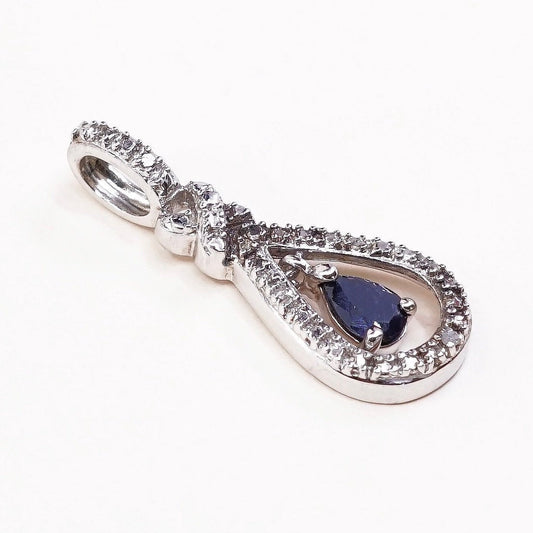 Sterling silver pendant with teardrop shaped sapphire, crystal around