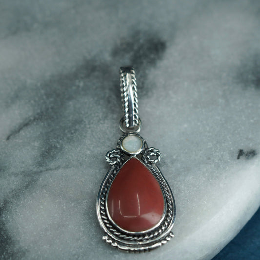 Vintage Sterling 925 silver handmade pendant with teardrop coral and cable trim