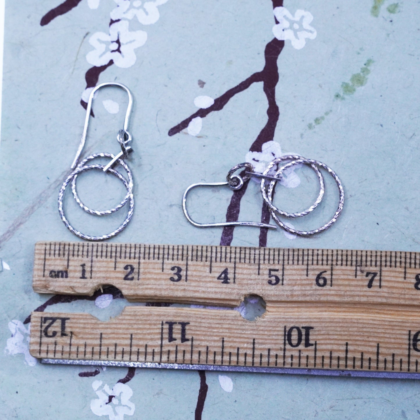 Dyadema sterling silver handmade earrings, textured 925 entwined circle dangles