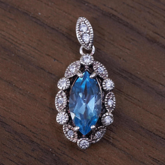 Vintage Sterling 925 silver handmade pendant with blue topaz and cz around