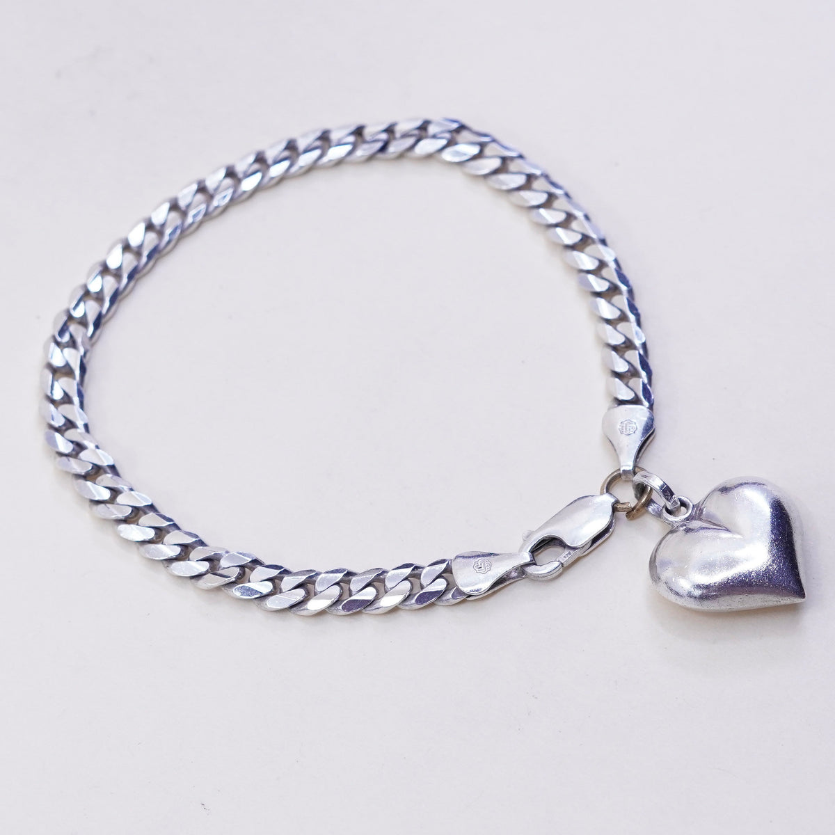 7.75”, sterling silver flatten curb bracelet, bold 925 chain with heart charm