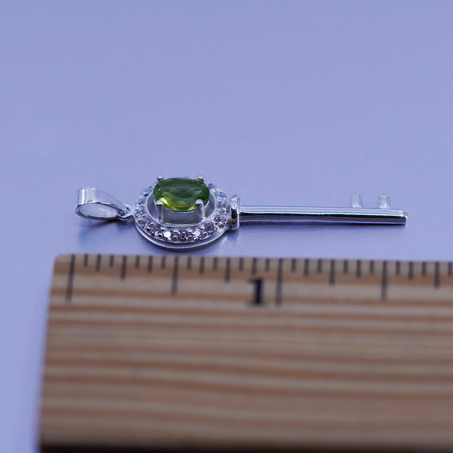 Vintage sterling 925 silver key pendant with peridot and cz