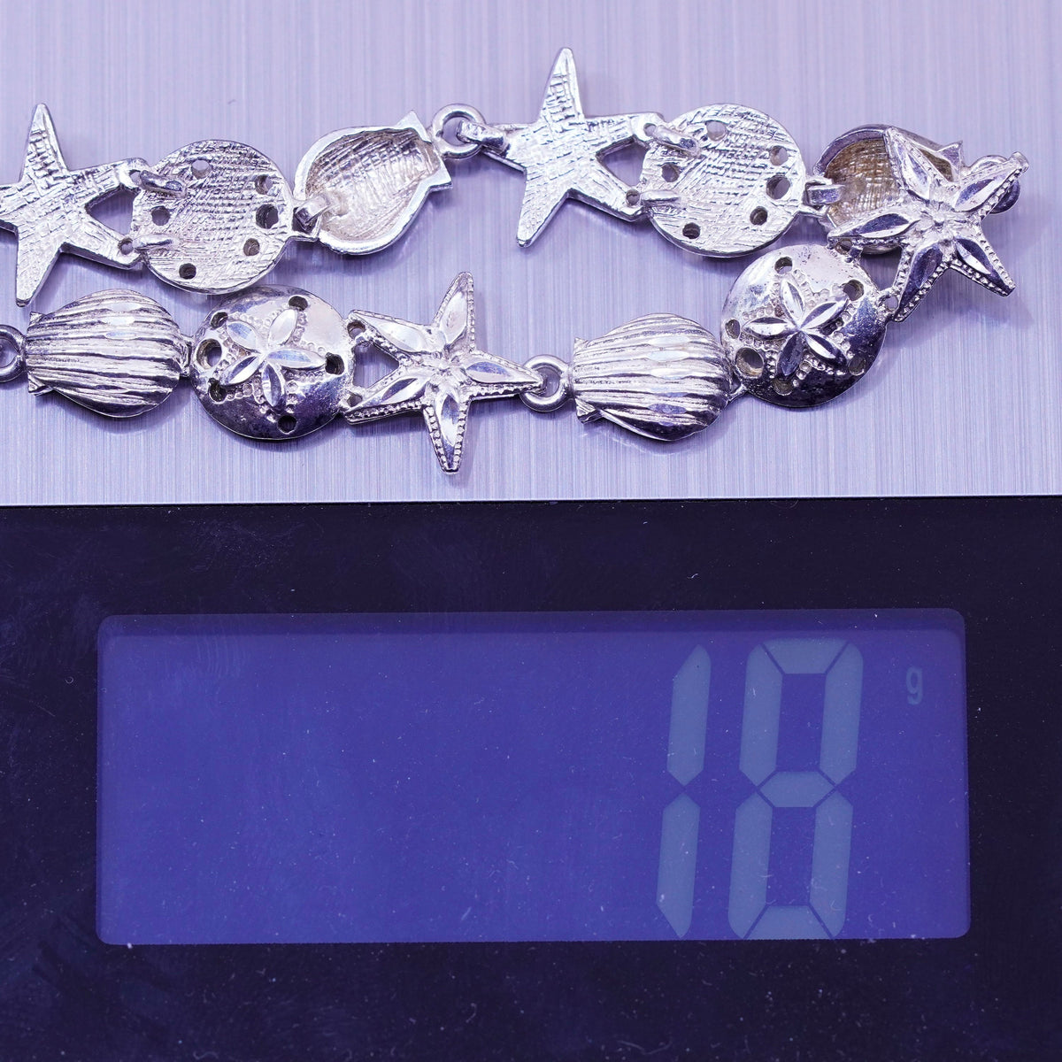 7.75”, ocean lover Sterling silver bracelet, 925 sand dollar, shell, starfish