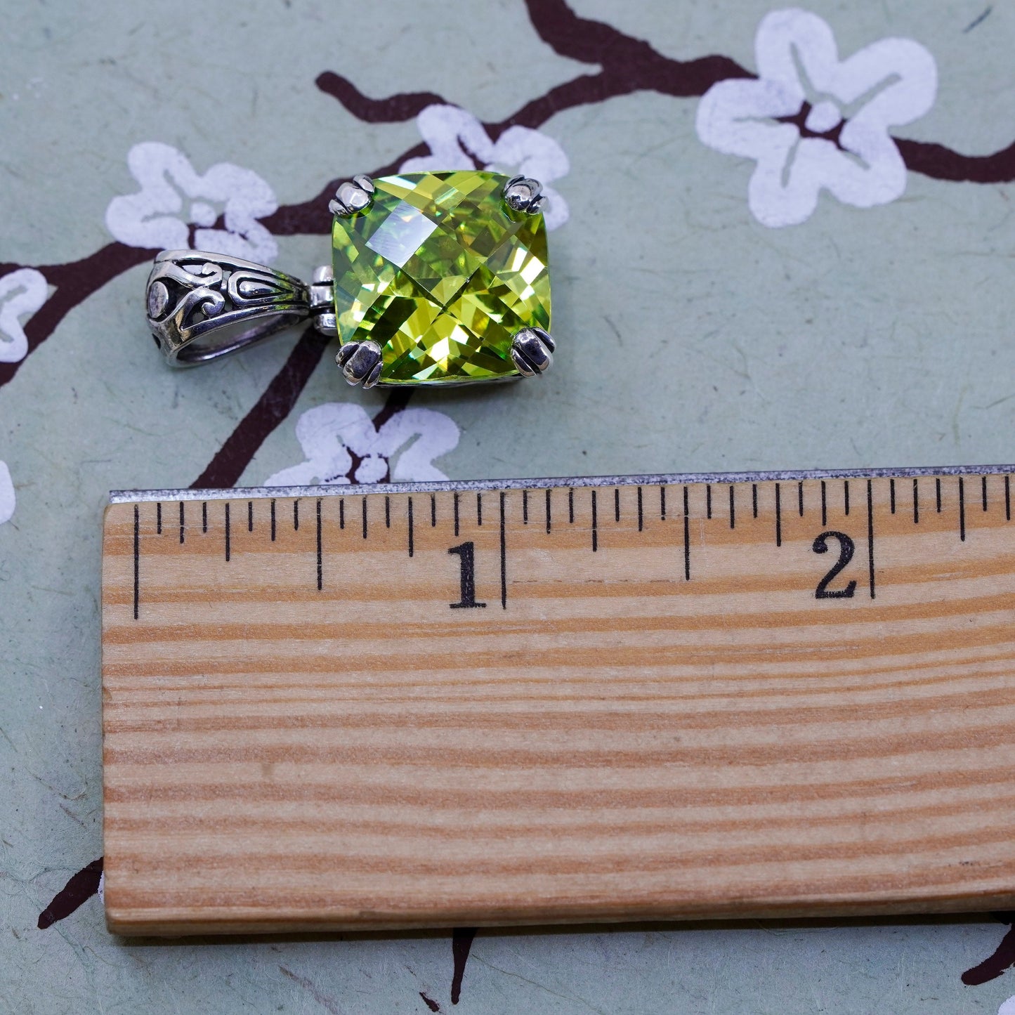 Vintage Sterling 925 silver pendant with peridot evil eye embossed on the side