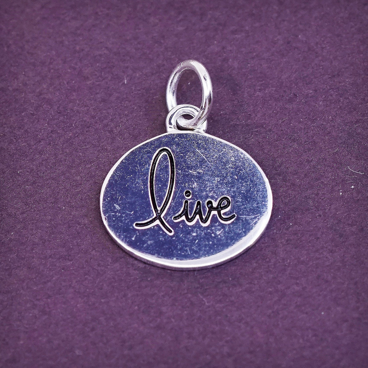vtg Sterling silver handmade charm, 925 tag pendant embossed “live”