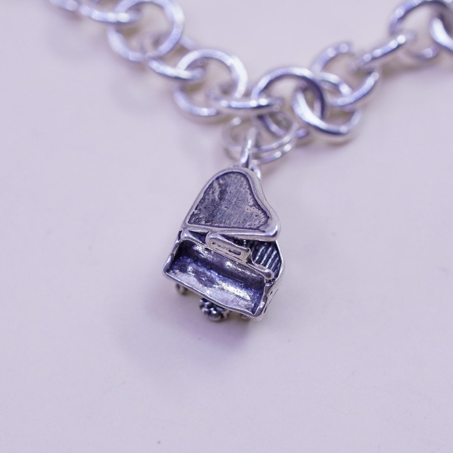 6.75” sterling silver bracelet, bold circle chain heart bible cross piano