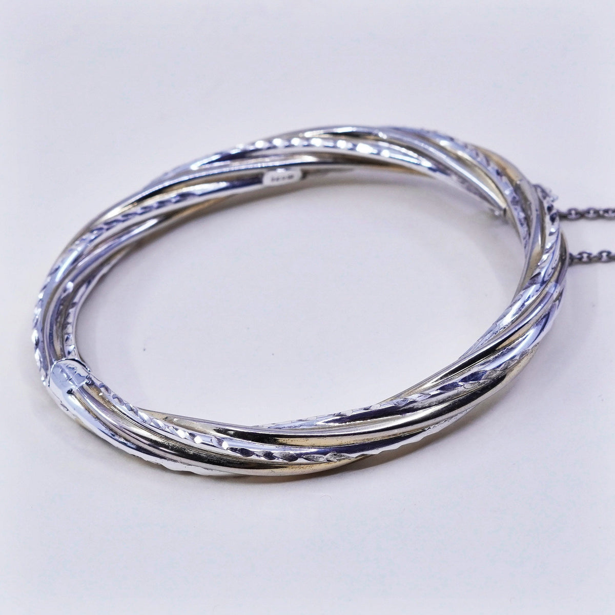 7.25”, two tone sterling silver bracelet, 925 hinged diamond twisted bangle