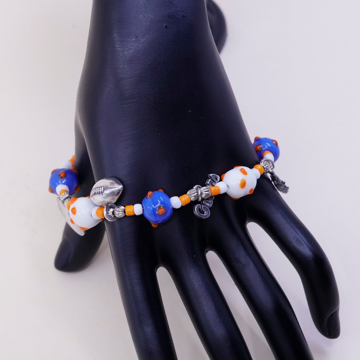 7.75”, blue and orange glass beads w/ sterling 925 silver alligator football