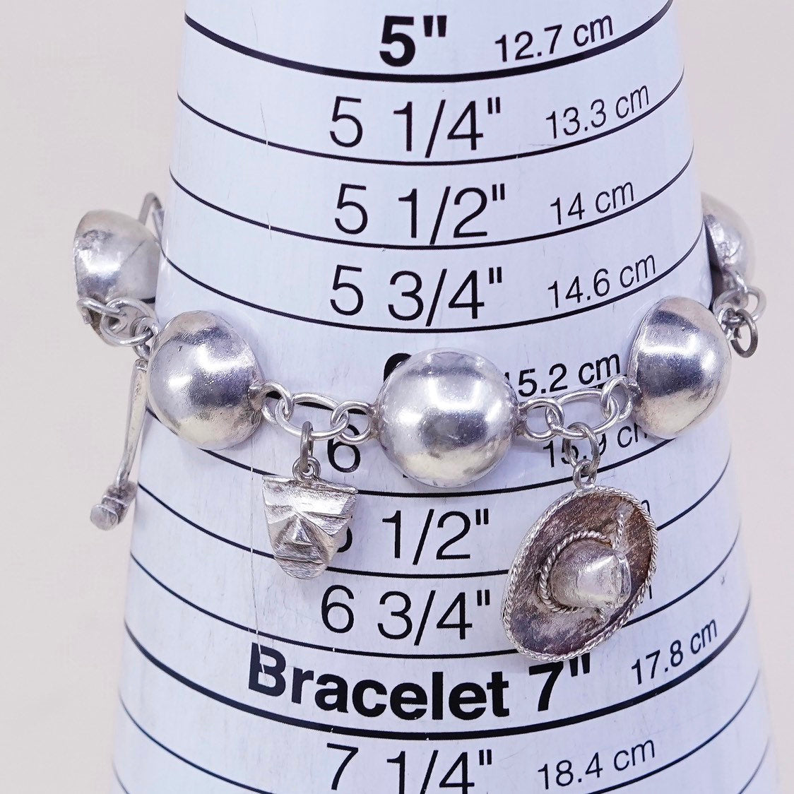 6”, sterling silver Handmade circle bracelet w/ hammer pot hat key sombrero