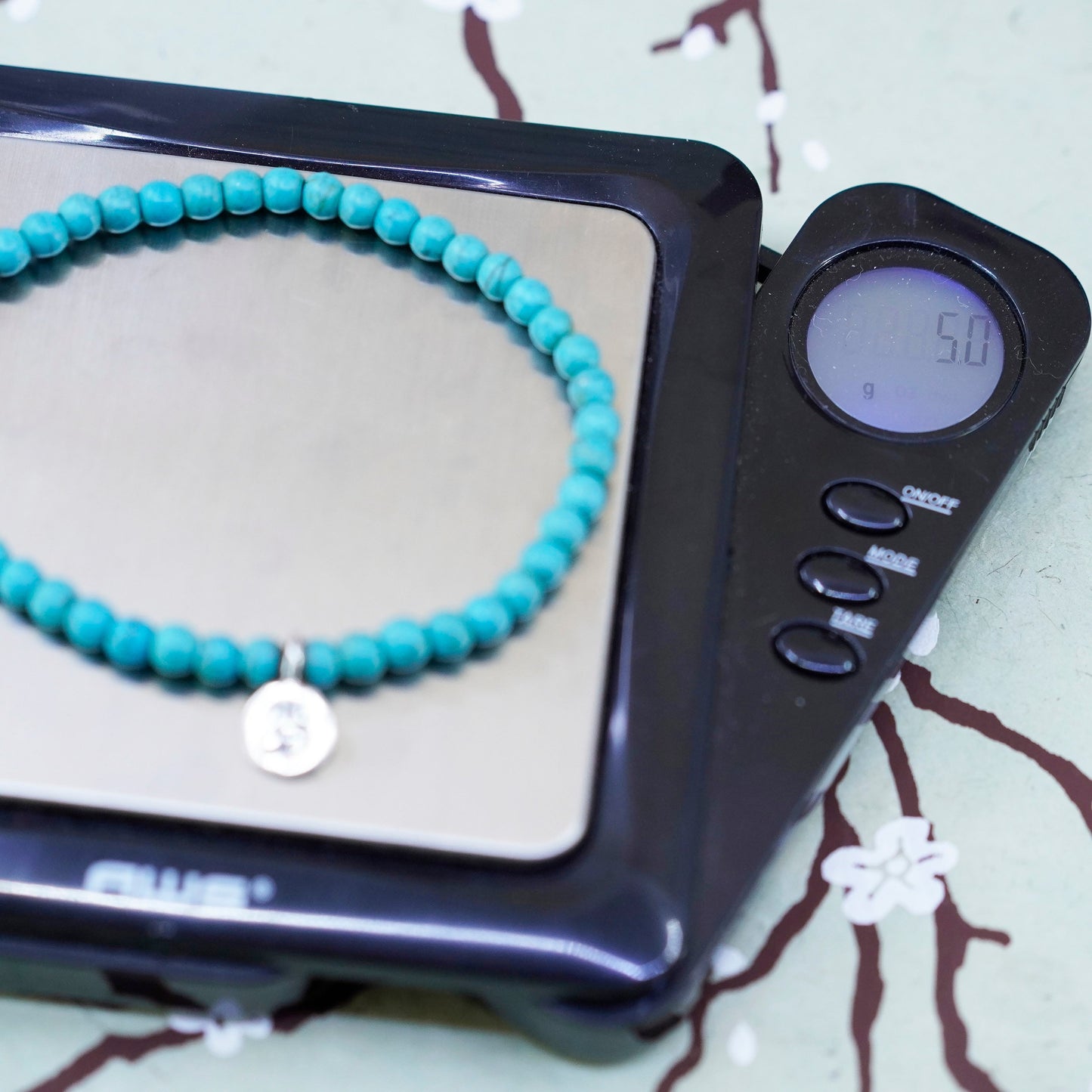 6.75”, handmade bracelet turquoise beads elastic band sterling 925 silver charm