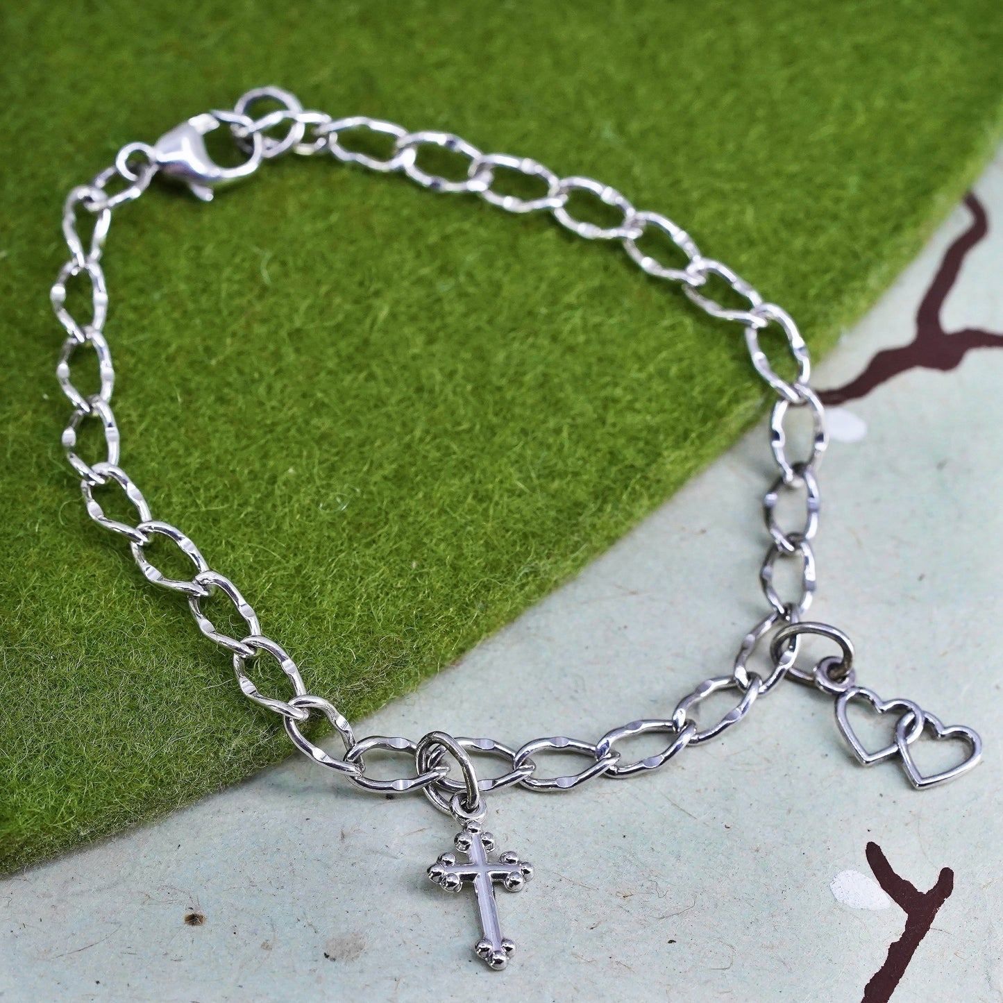 6.75”, sterling 925 silver twisted curb bracelet and cross double heart charms