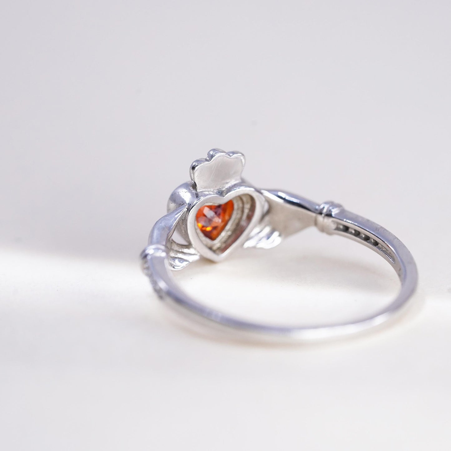 Size 8, Irish sterling 925 silver claddagh ring, holding heart, orange crystal