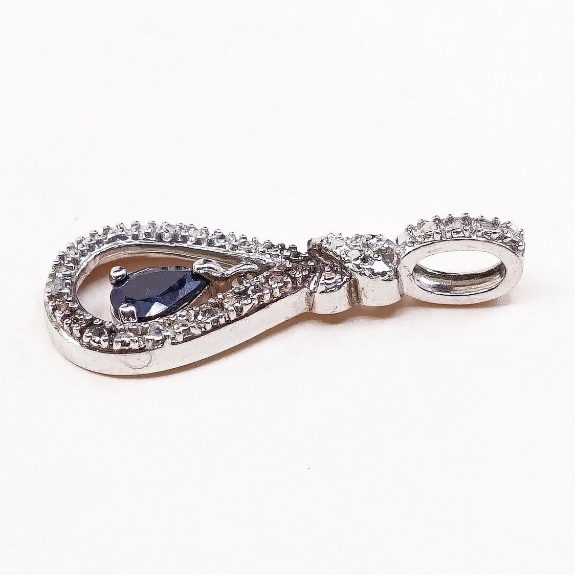 Sterling silver pendant with teardrop shaped sapphire, crystal around