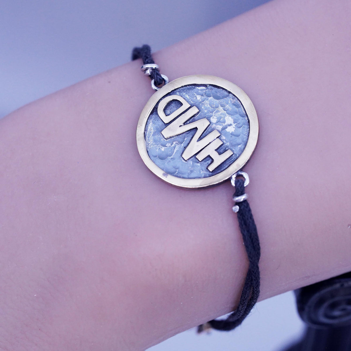 6.75", Signed two tone sterling 925 silver monogram "HDM" tag black bracelet