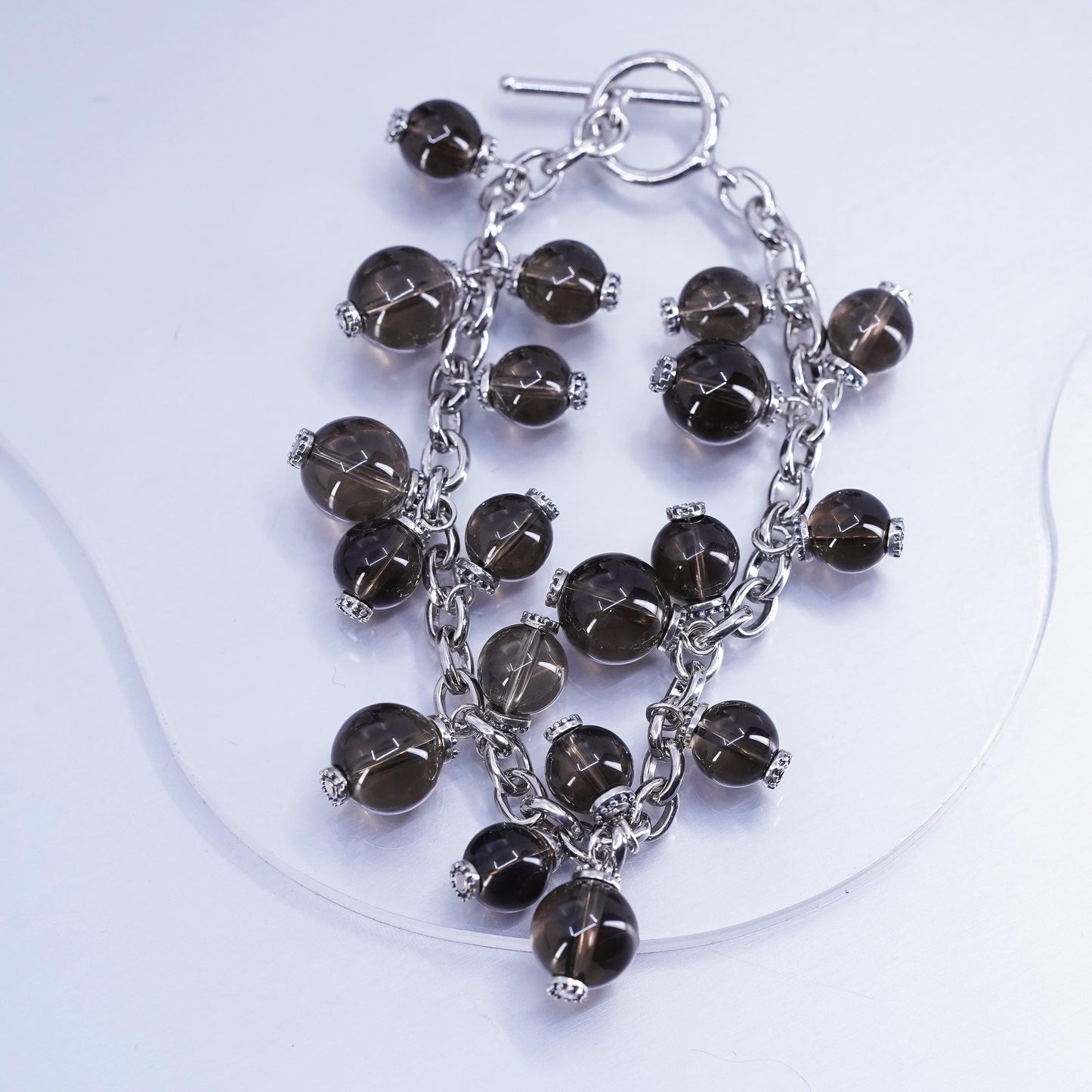 6.75”, Sterling 925 silver bracelet with smoky crystal beads and toggle closure