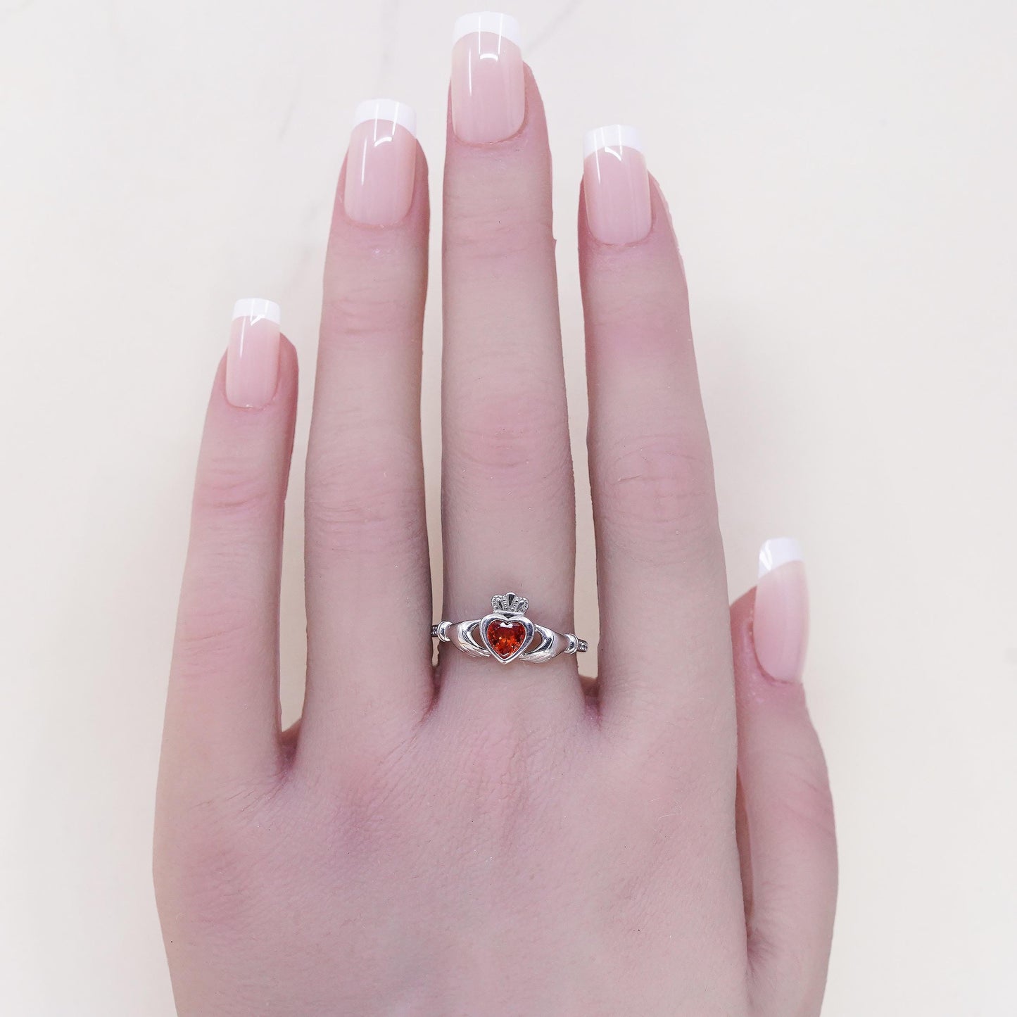 Size 8, Irish sterling 925 silver claddagh ring, holding heart, orange crystal