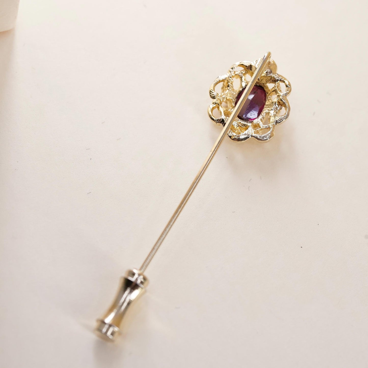 Vintage gold tone pin with garnet