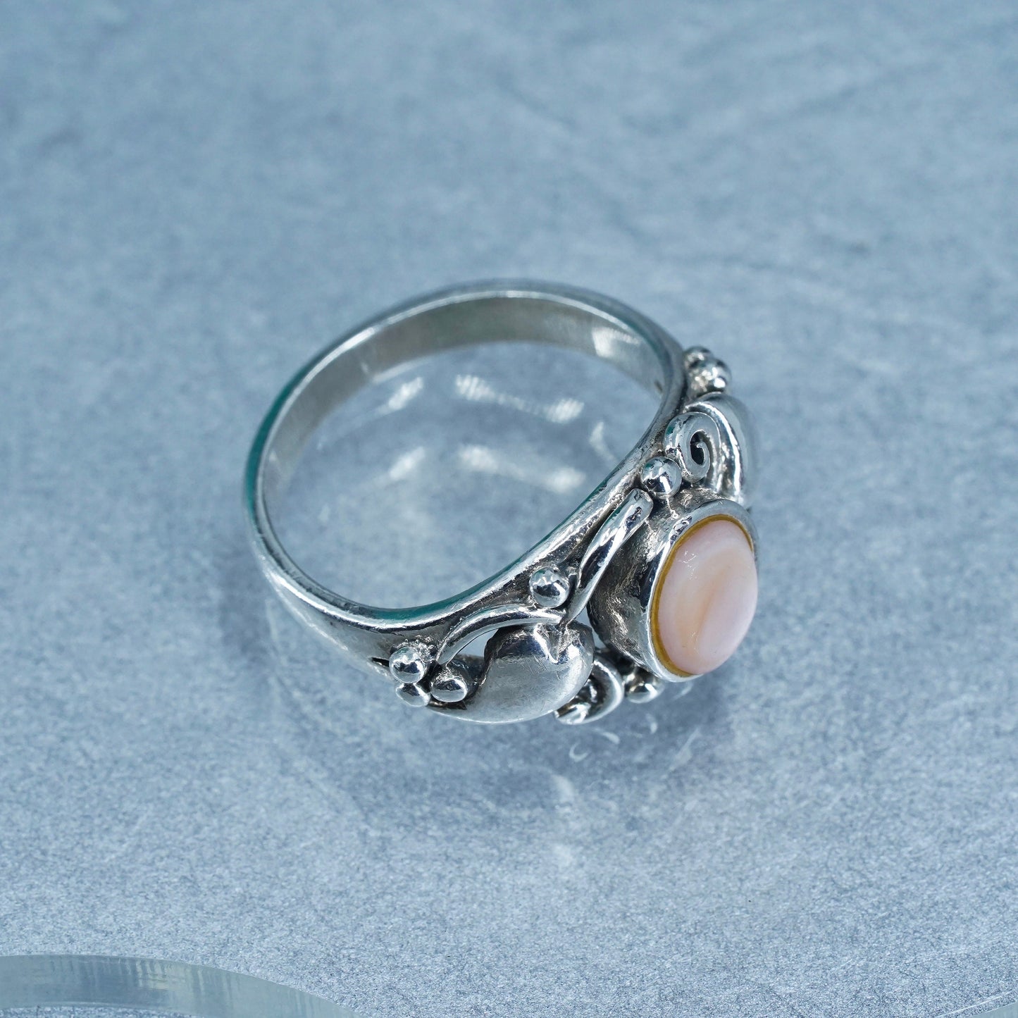 Size 8.25, Sterling 925 silver ring with pink mother of pearl and hearts around