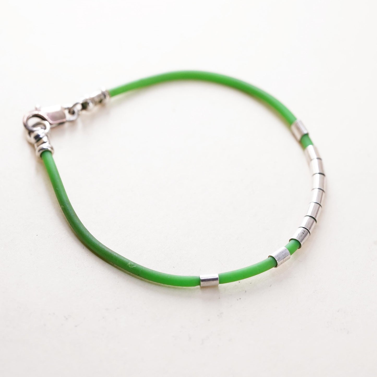 6”, Vintage green rubber band stackable bracelet with silver tone details
