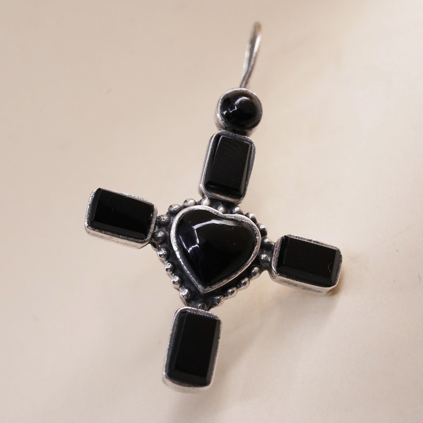 Vintage handmade single earring. Sterling 925 silver heart cross with onyx