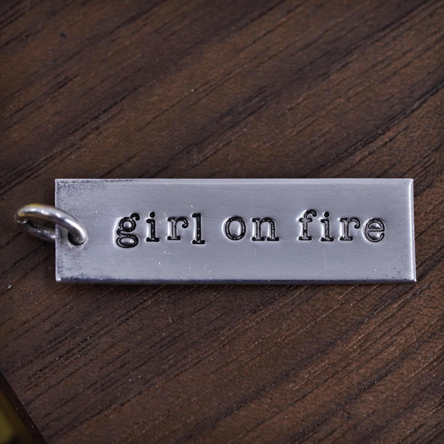 Sterling silver charm, 925 tag pendant embossed “girl on fire”