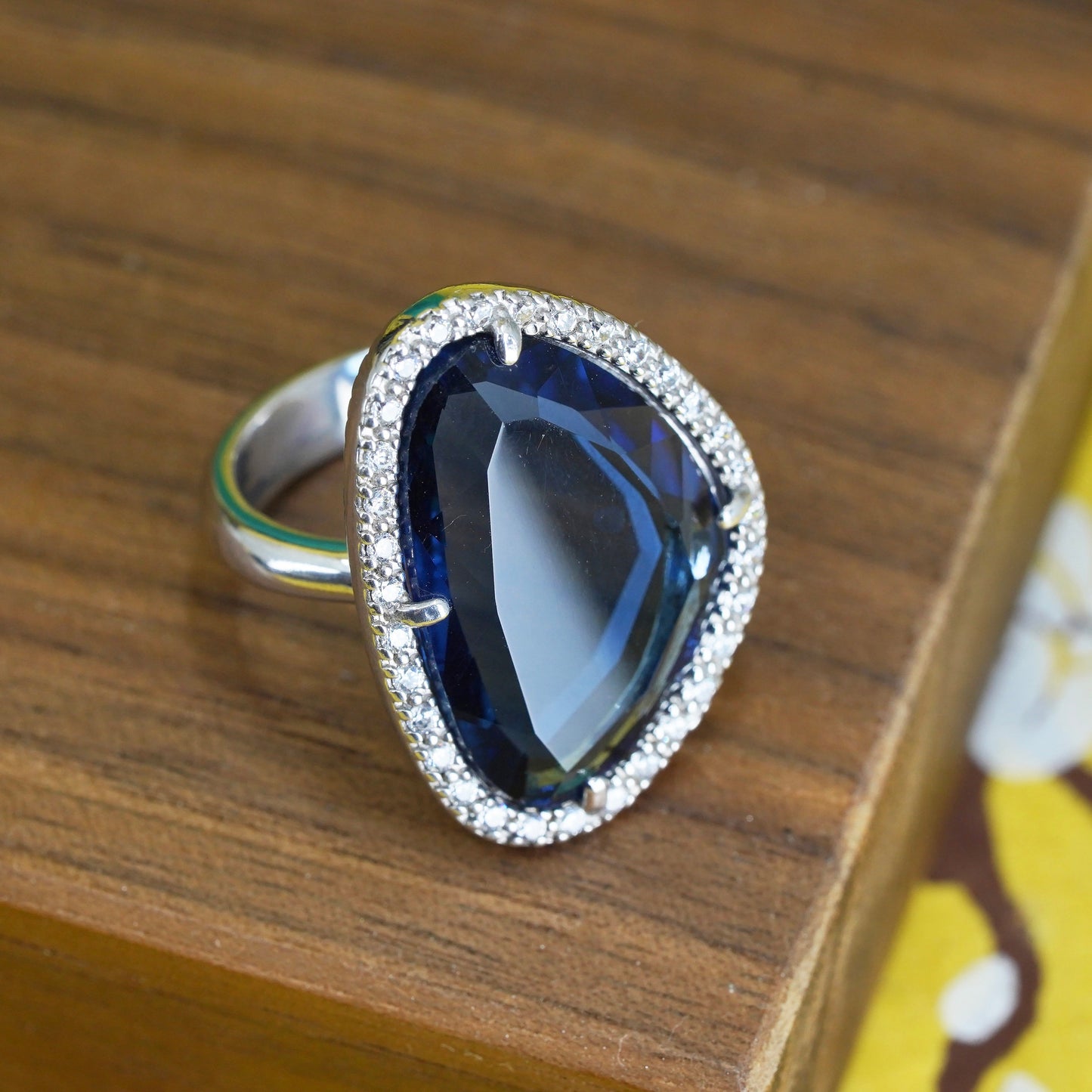Size 7.25, vintage Sterling 925 silver ring with blue crystal and cz around