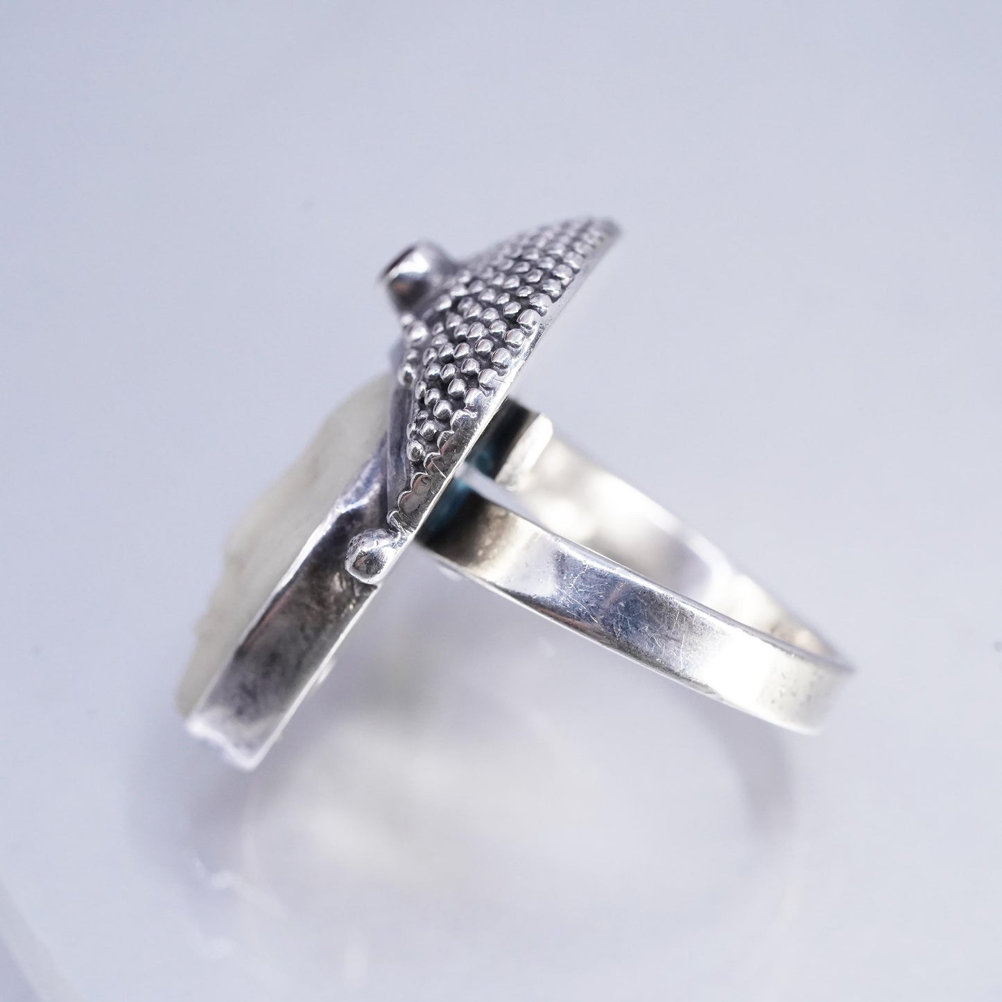 Size 7.5, vintage Sterling 925 silver ring with carved goddess face and garnet