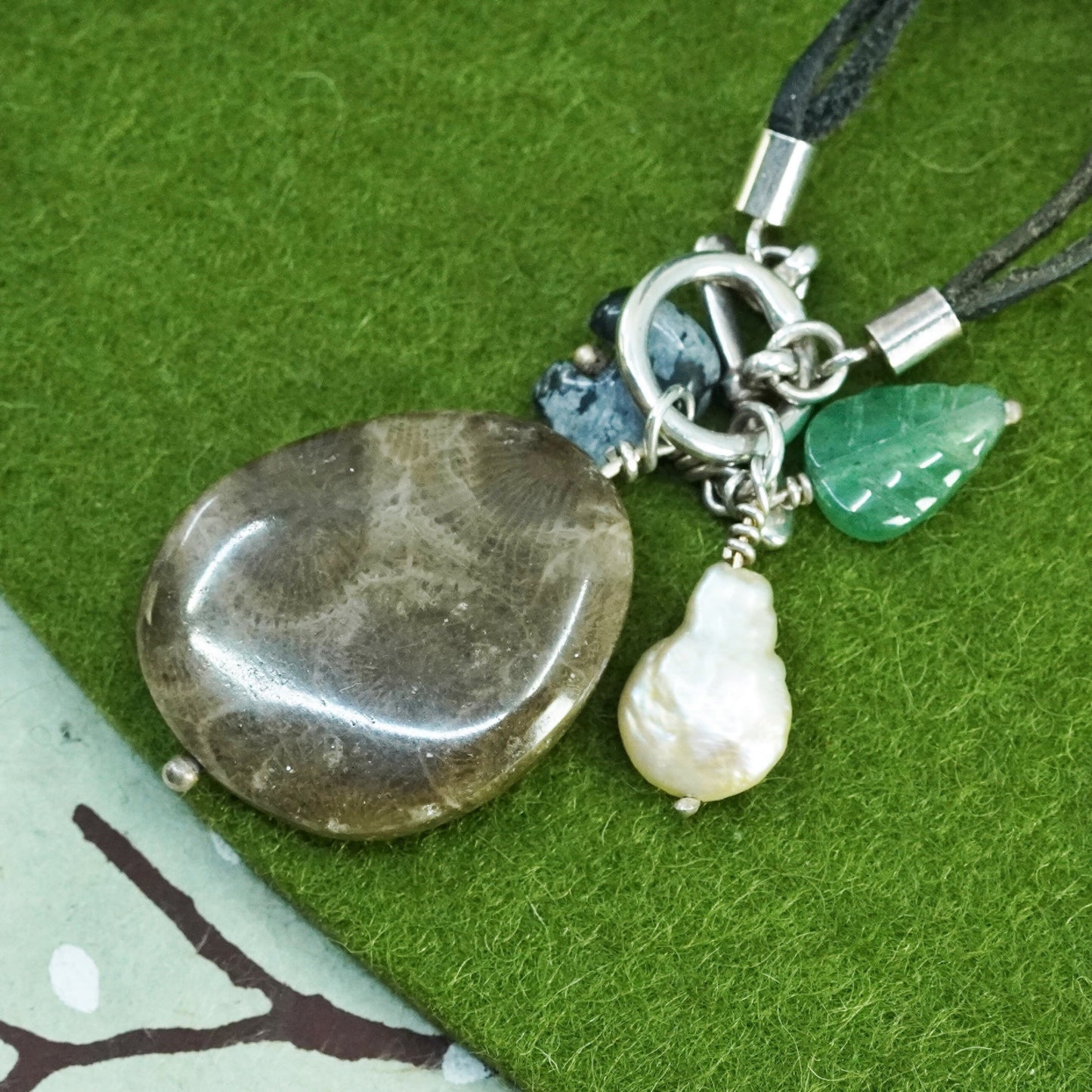 18”, Native American leather necklace with fossil coral pendant, jade leaf