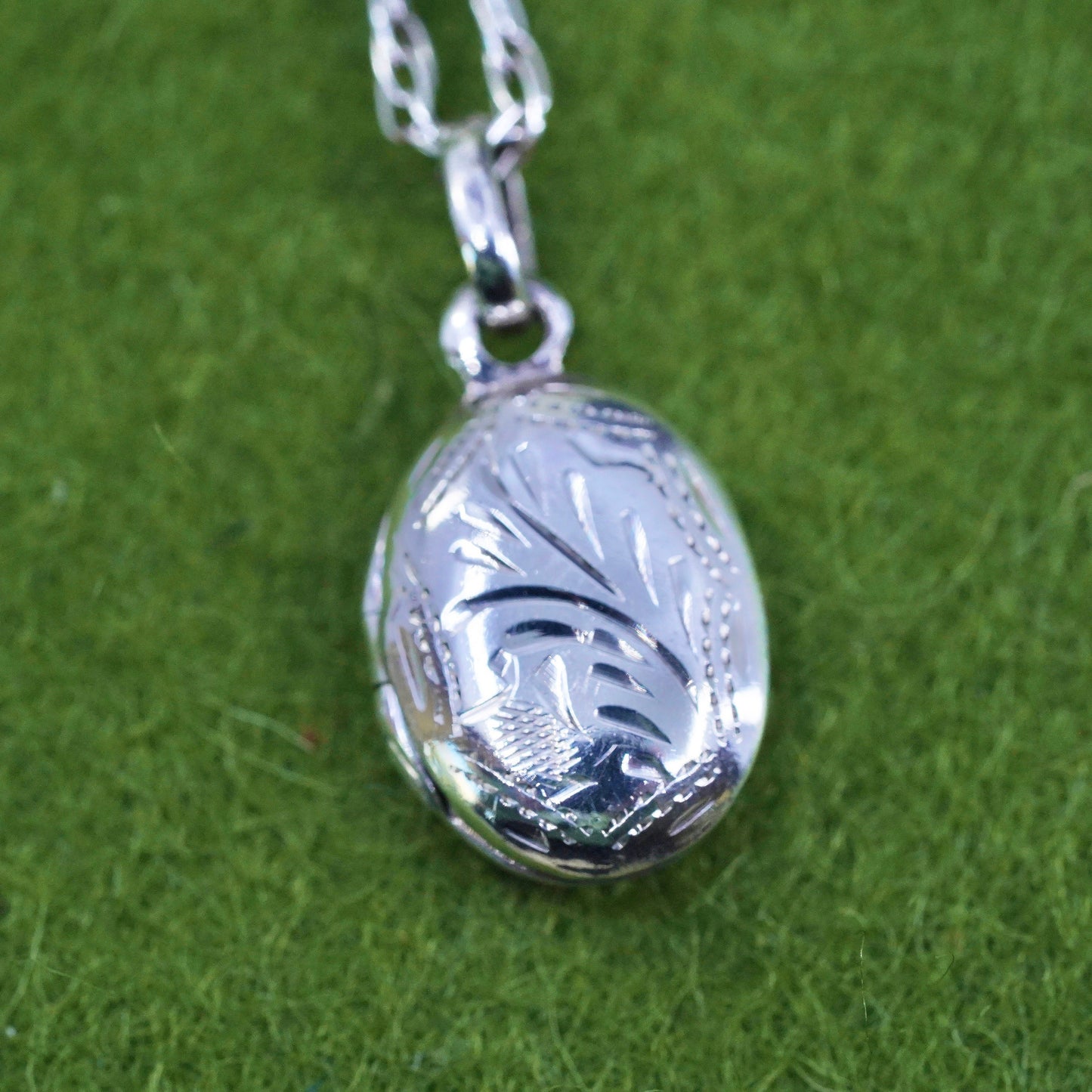 17”, sterling silver necklace, 925 Singapore rope chain oval lock pendant