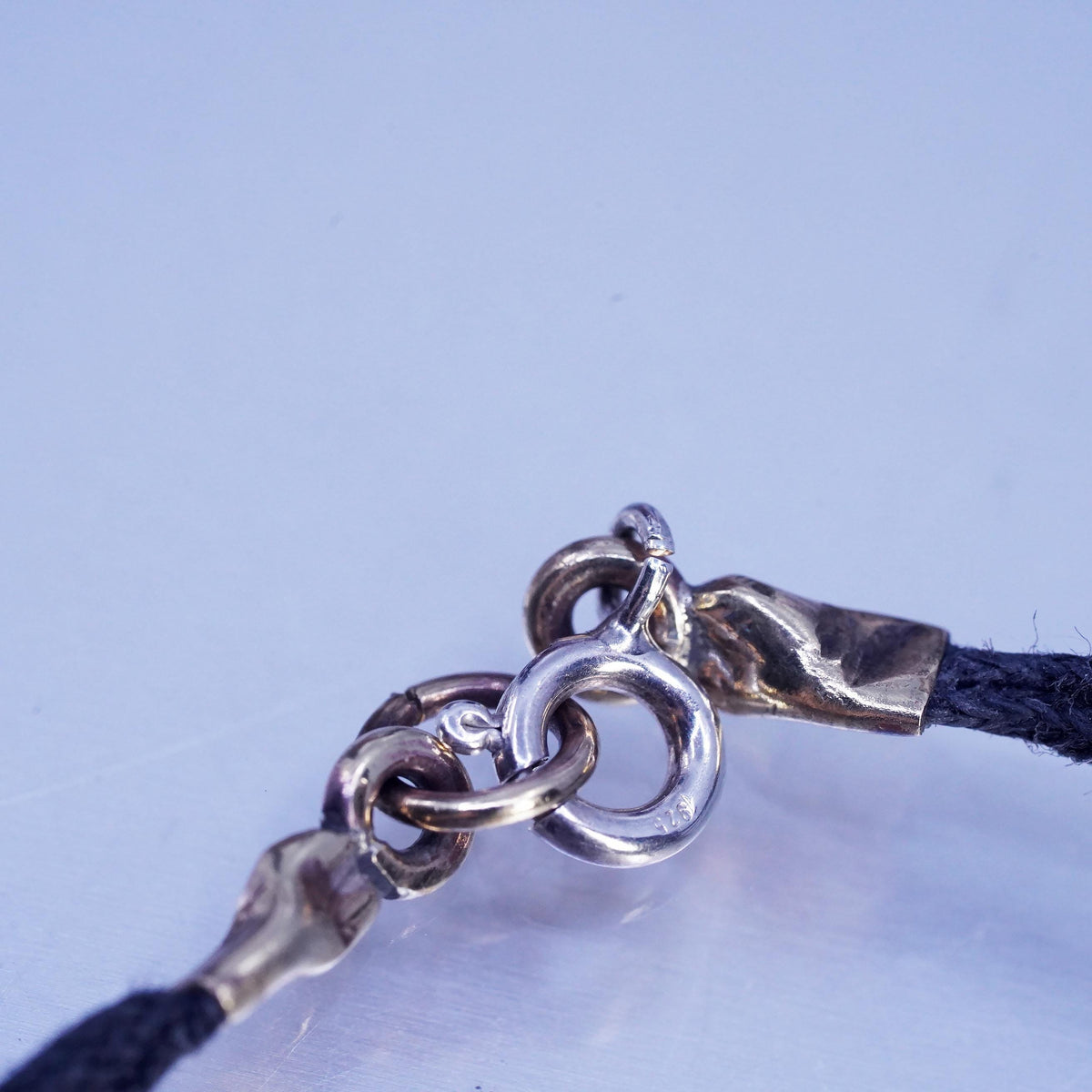 6.75", Signed two tone sterling 925 silver monogram "HDM" tag black bracelet