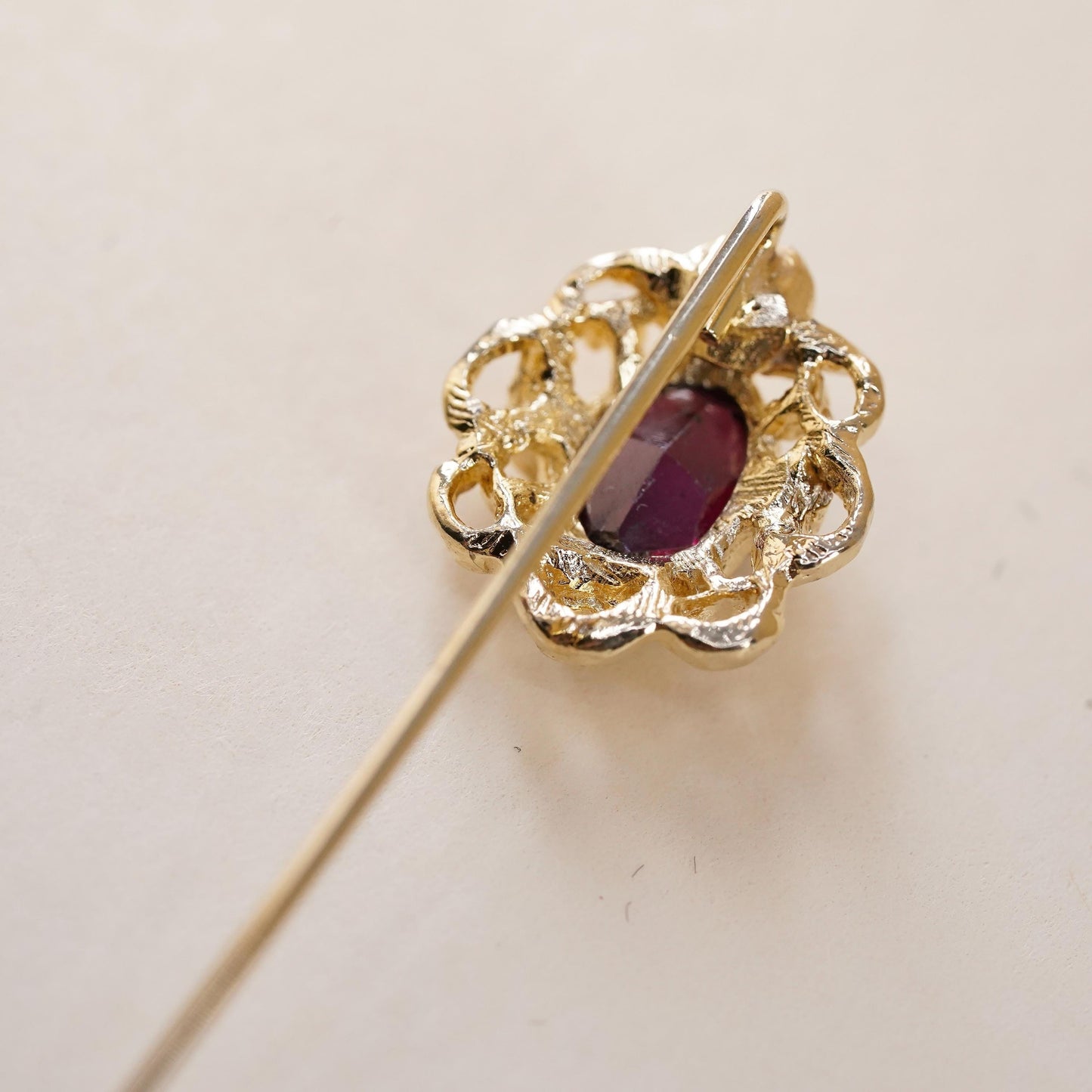 Vintage gold tone pin with garnet