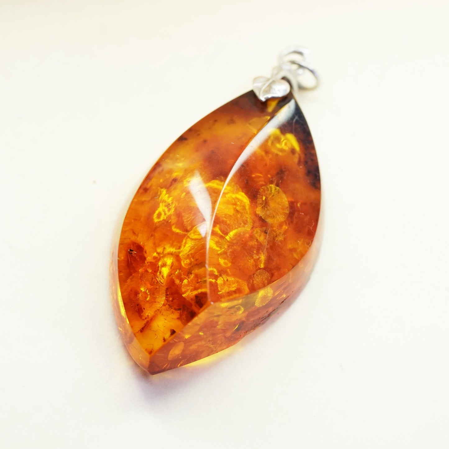 Vintage sterling 925 silver handmade pendant with amber nugget and leaf bail