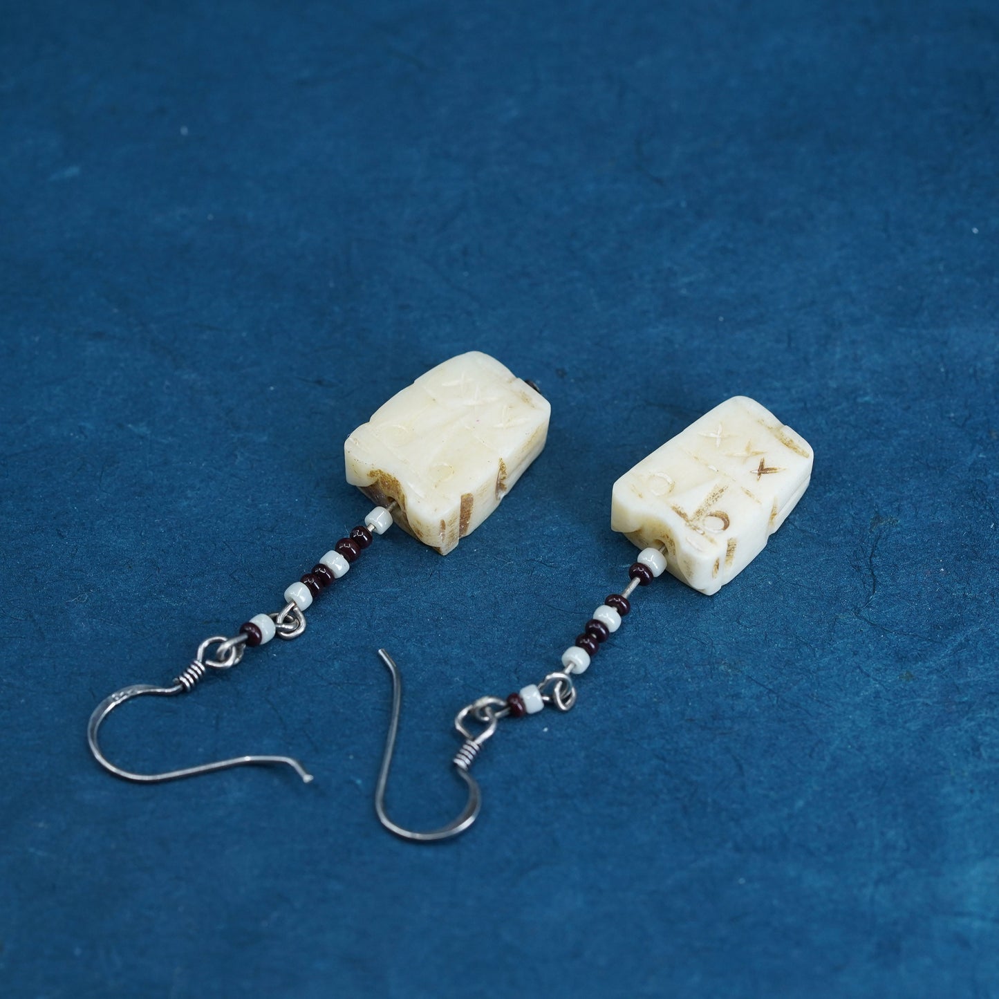 Vintage southwestern sterling silver handmade earrings with carved seed dangles