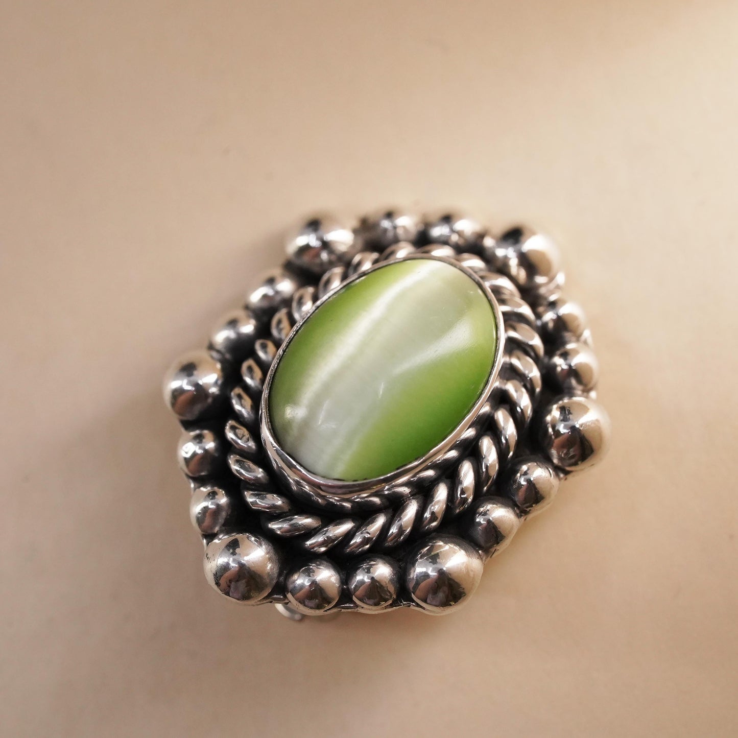 Mexican sterling silver single earring, 925 silver clip on with green cat’s eye