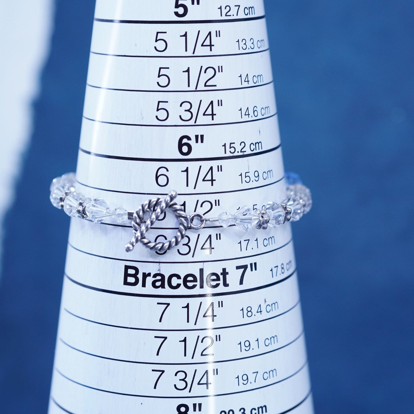 6.75”, Sterling 925 silver bracelet with blue crystal and believe god charms