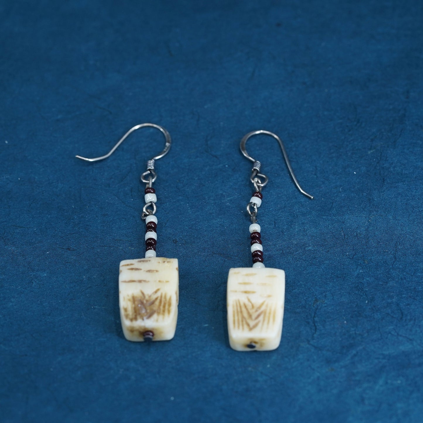 Vintage southwestern sterling silver handmade earrings with carved seed dangles