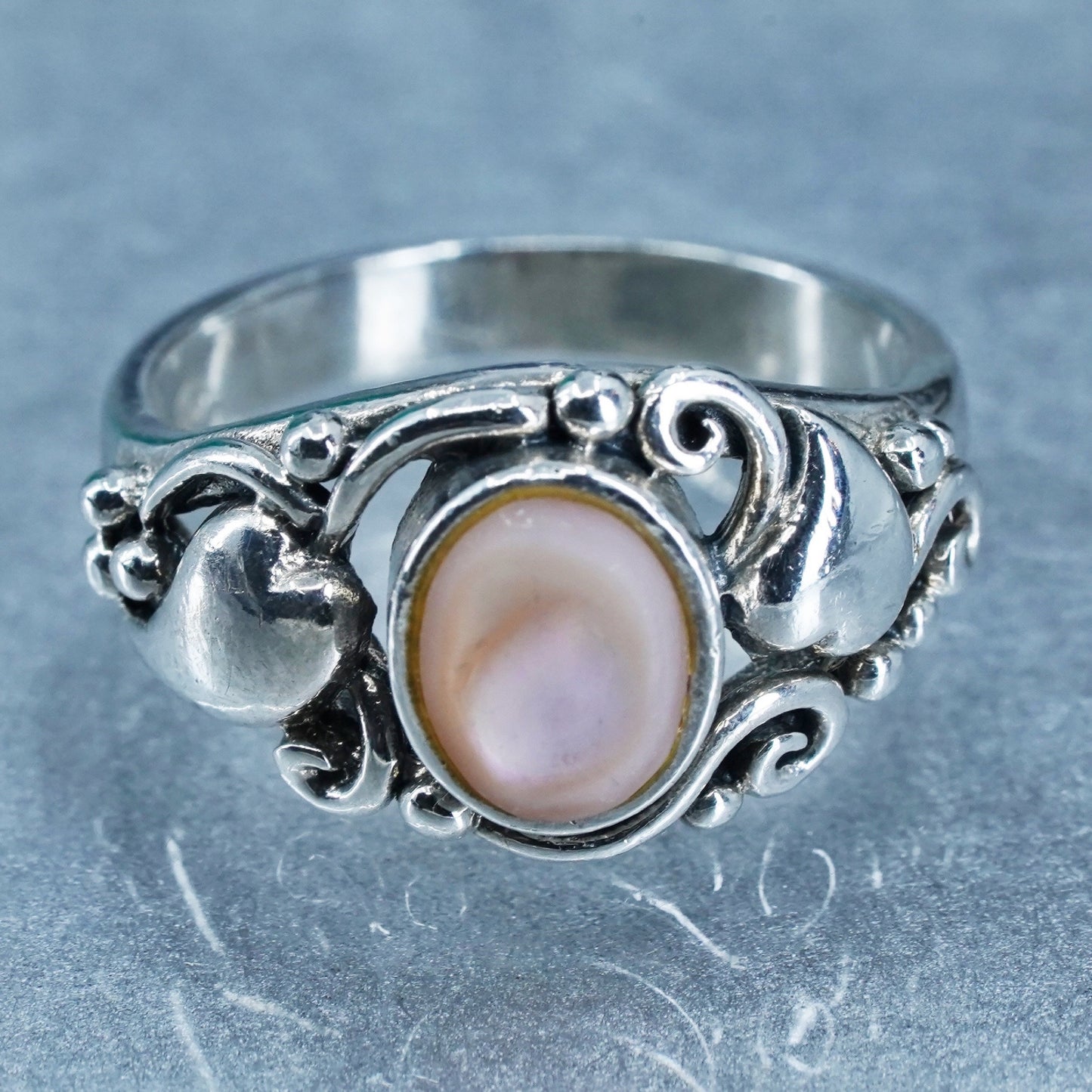 Size 8.25, Sterling 925 silver ring with pink mother of pearl and hearts around
