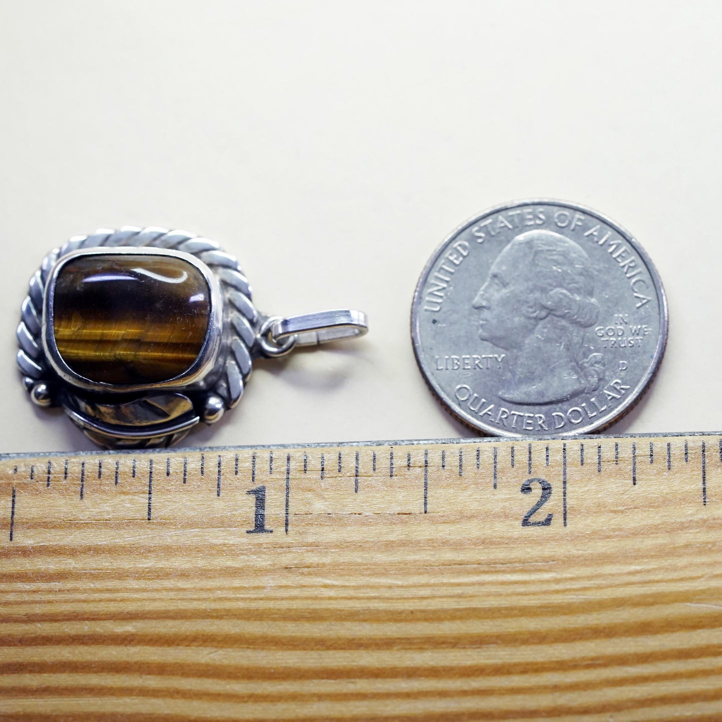 Vintage southwestern sterling 925 silver pendant with golden tiger eye feather