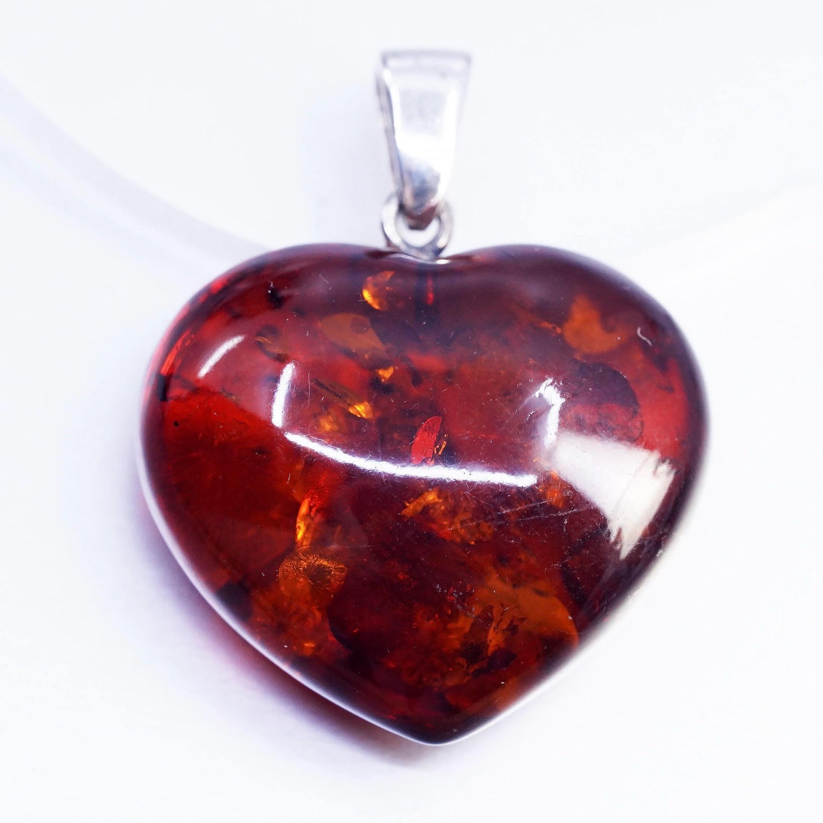 Vintage sterling 925 silver handmade pendant with heart amber