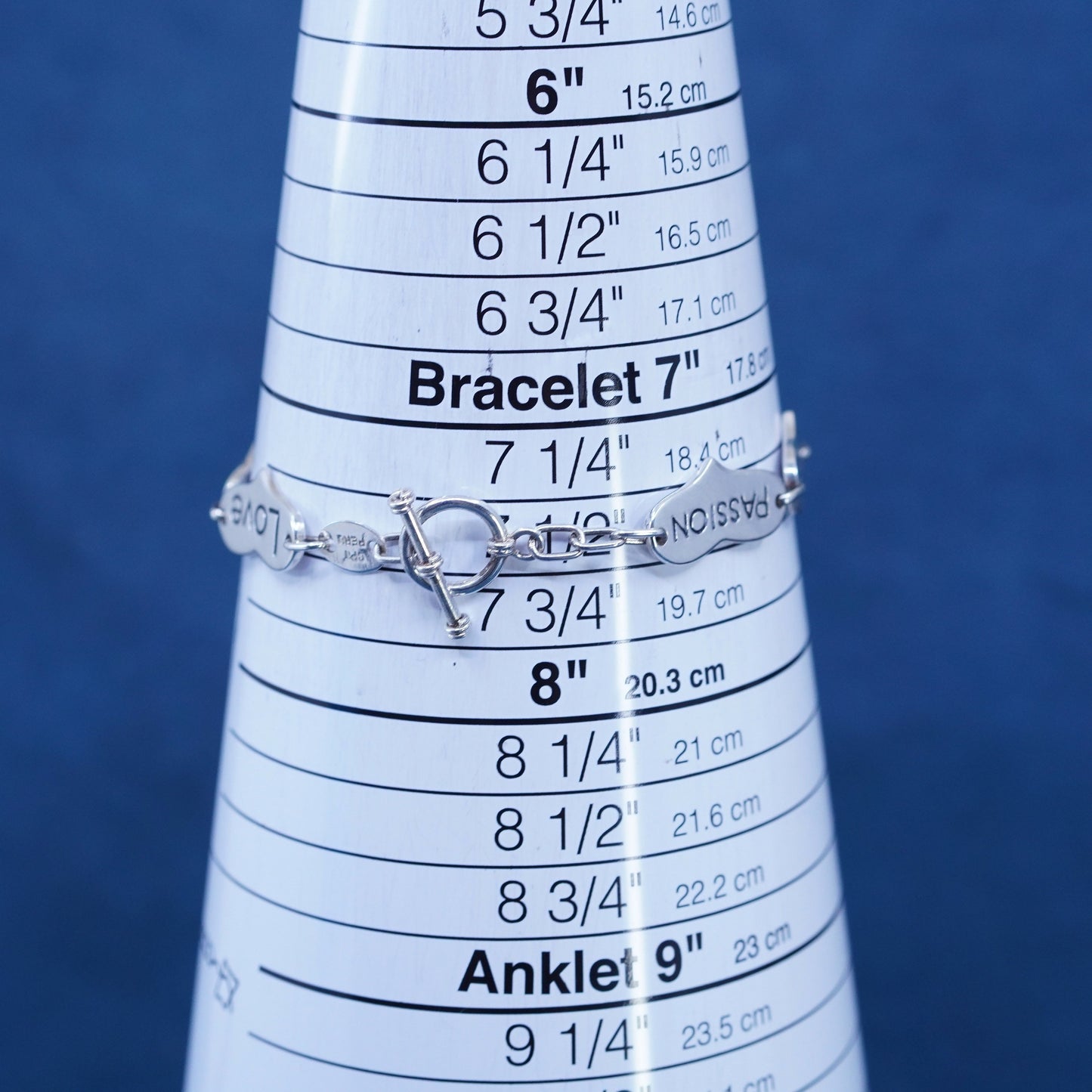7.5”, Sterling silver bracelet, 925 heart chain embossed “love trust strength