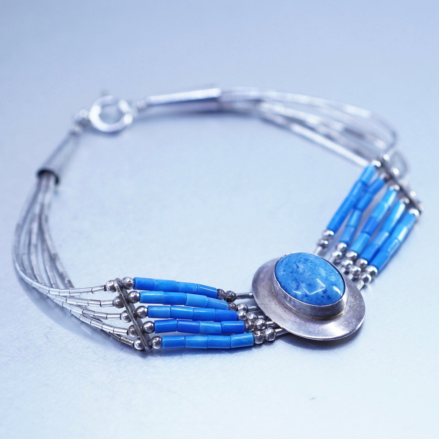 7.25”, Sterling 925 silver bracelet, liquid chain with denim lapis lazuli charm