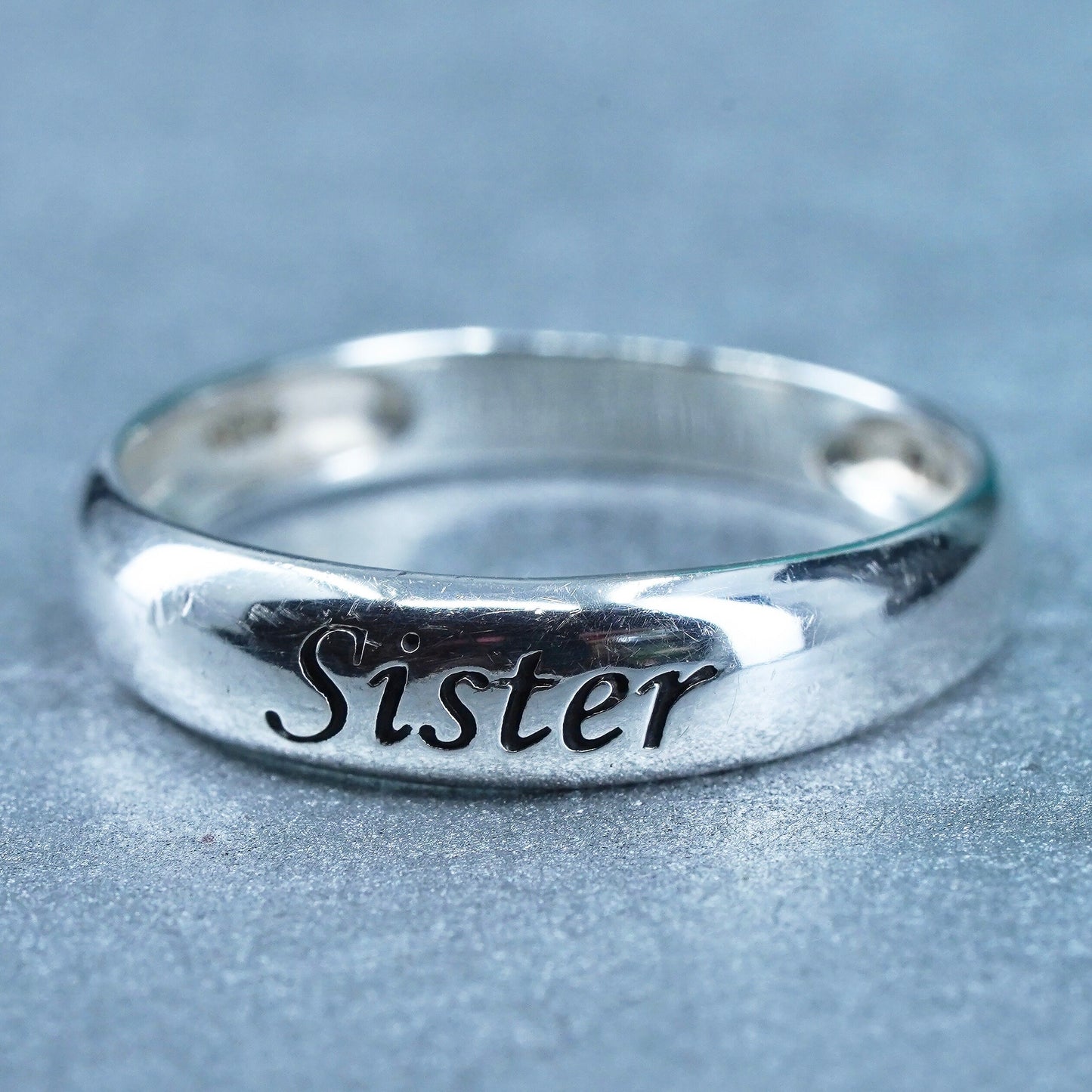 Size 7, vintage southwestern Sterling 925 silver ring, band embossed “sister”
