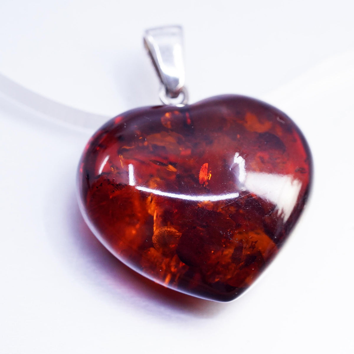 Vintage sterling 925 silver handmade pendant with heart amber
