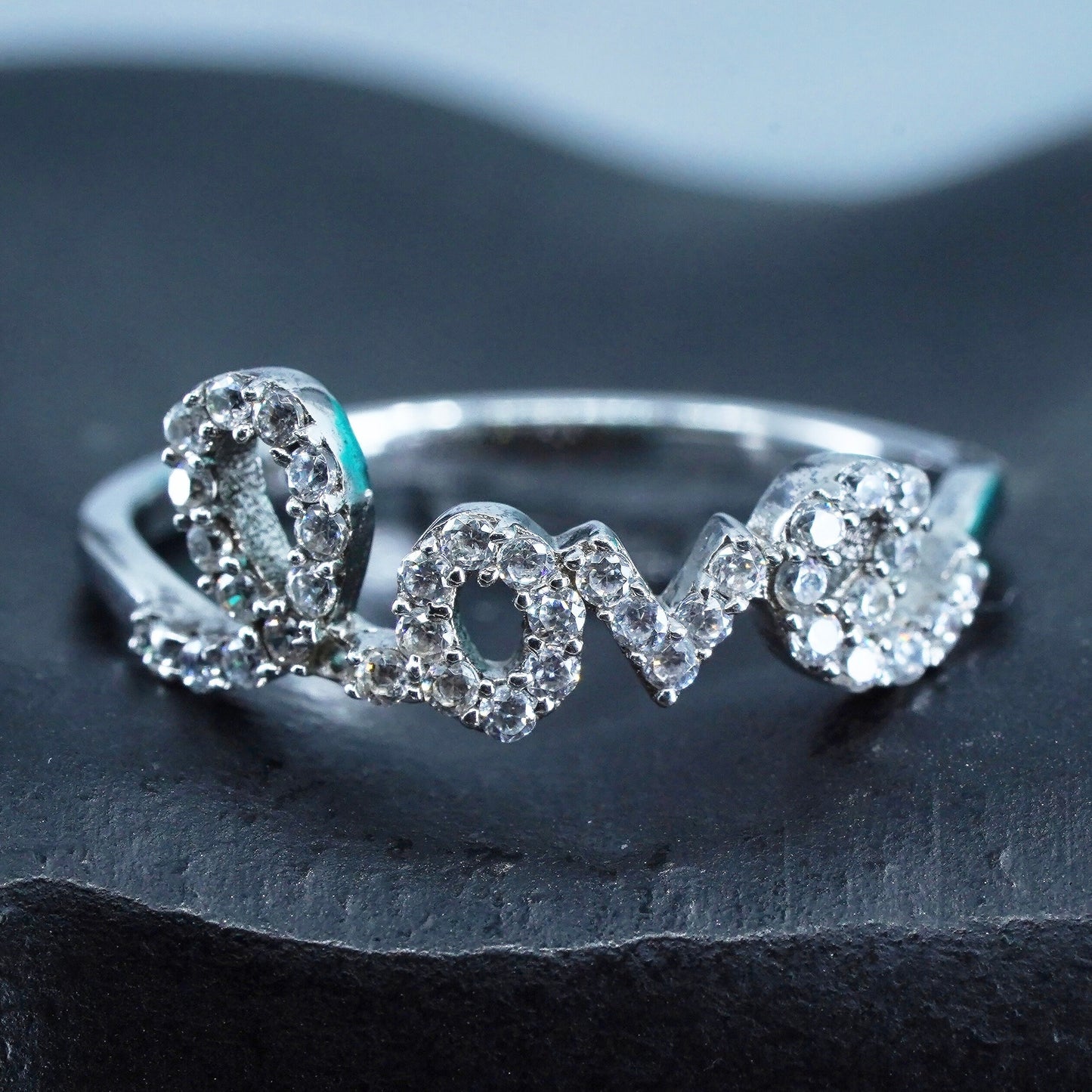 Size 8, southwestern Sterling 925 silver wedding ring, band with “love” and cz