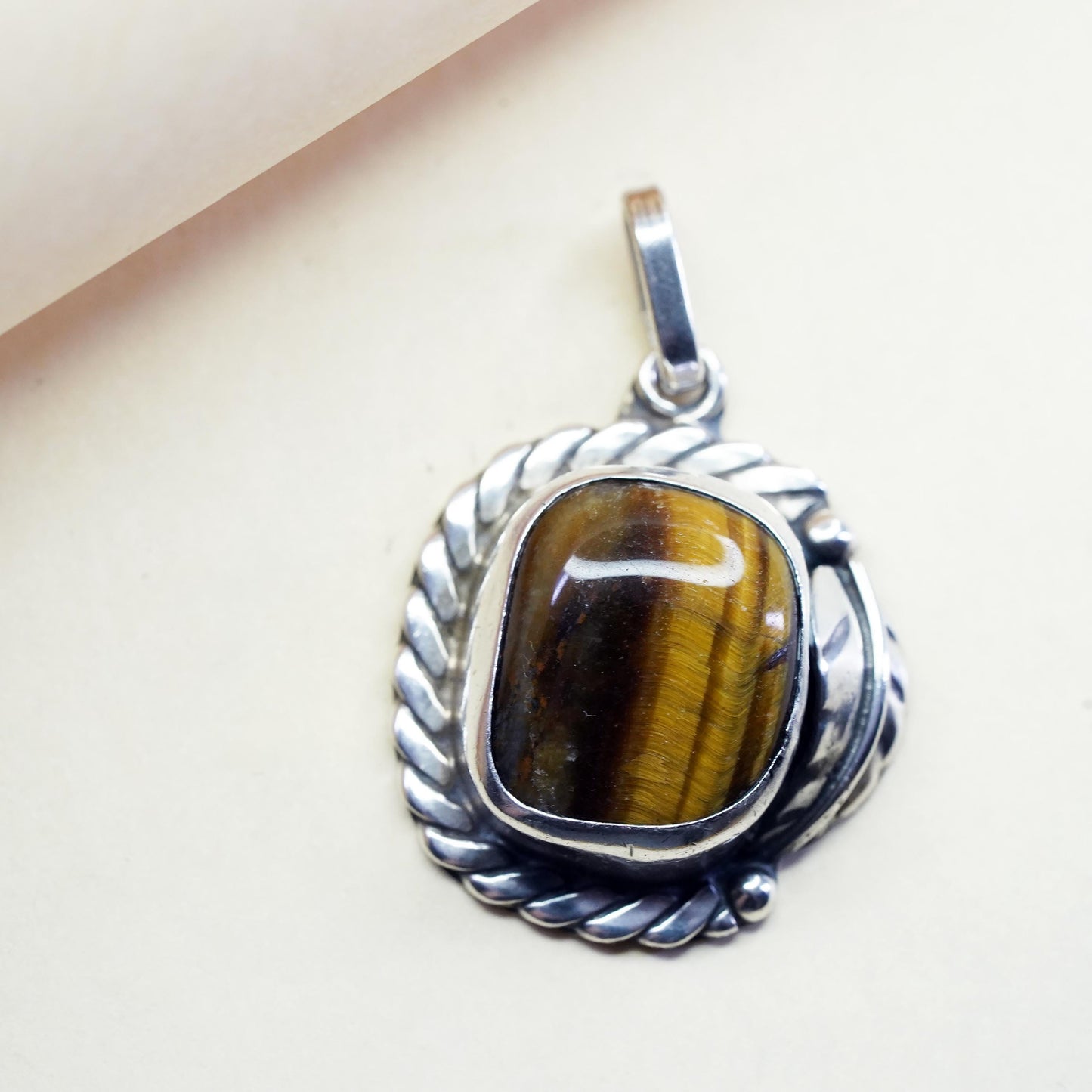 Vintage southwestern sterling 925 silver pendant with golden tiger eye feather