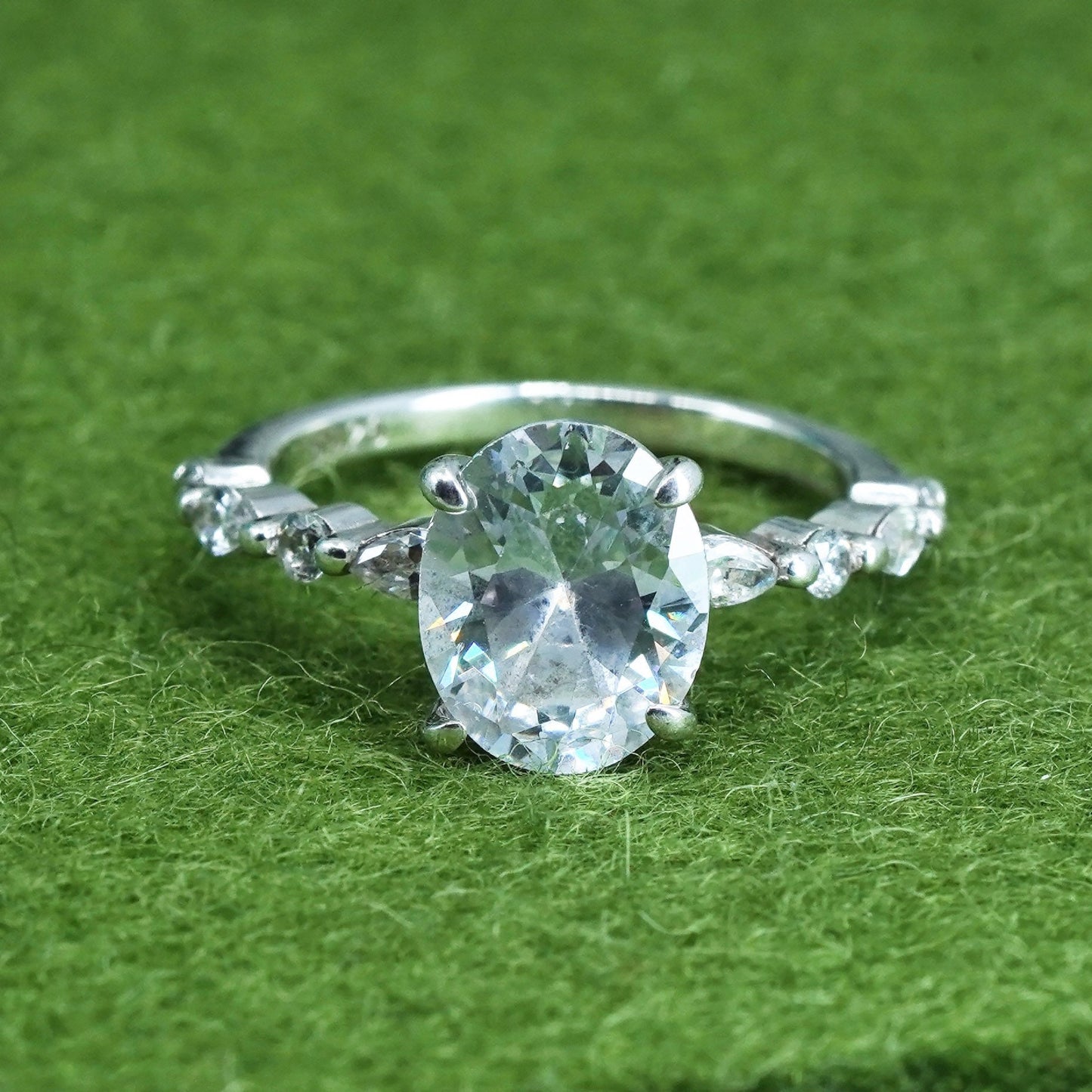 Size 5, Sterling 925 silver engagement ring with oval cut CZ and cluster cz