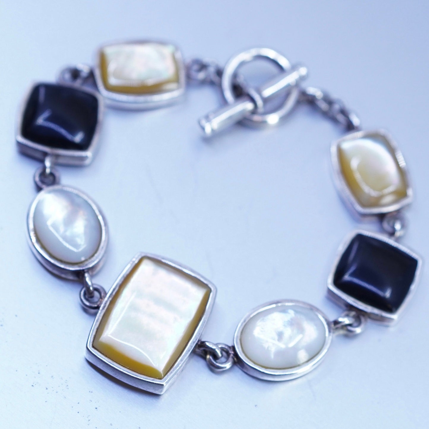 6.75”, VTG sterling 925 silver bracelet w/ black onyx golden mother of pearl