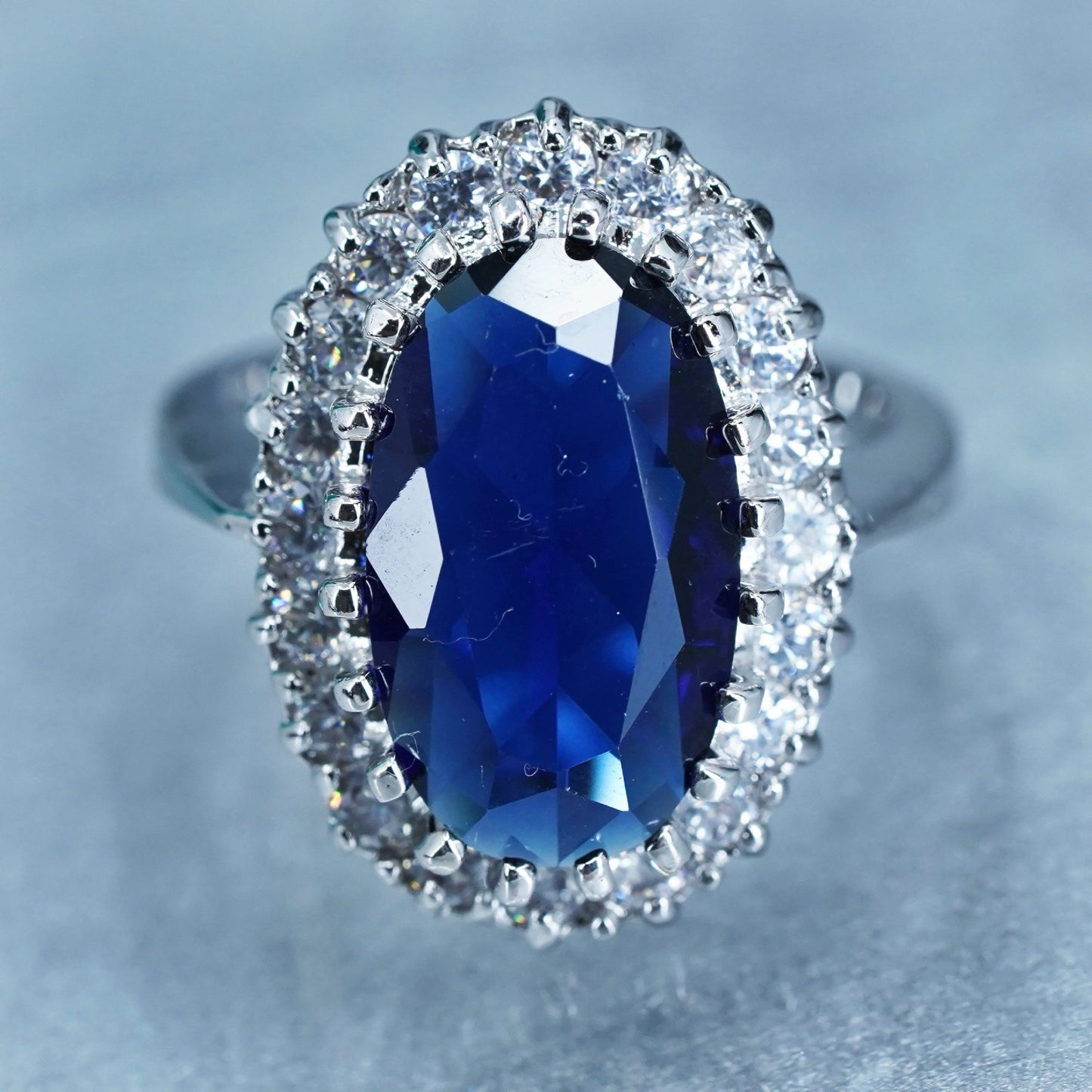Size 8.25, vintage silver tone statement ring with blue glass and cz around