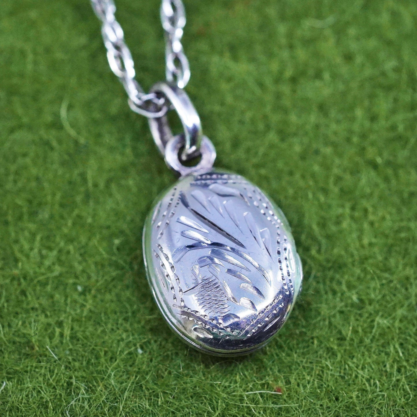 17”, sterling silver necklace, 925 Singapore rope chain oval lock pendant